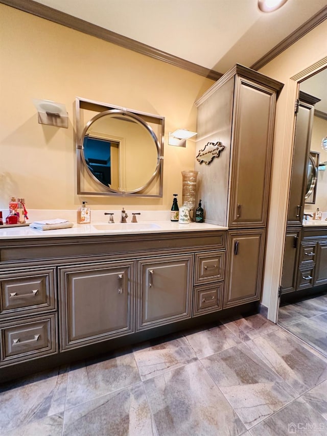 bathroom with crown molding and vanity