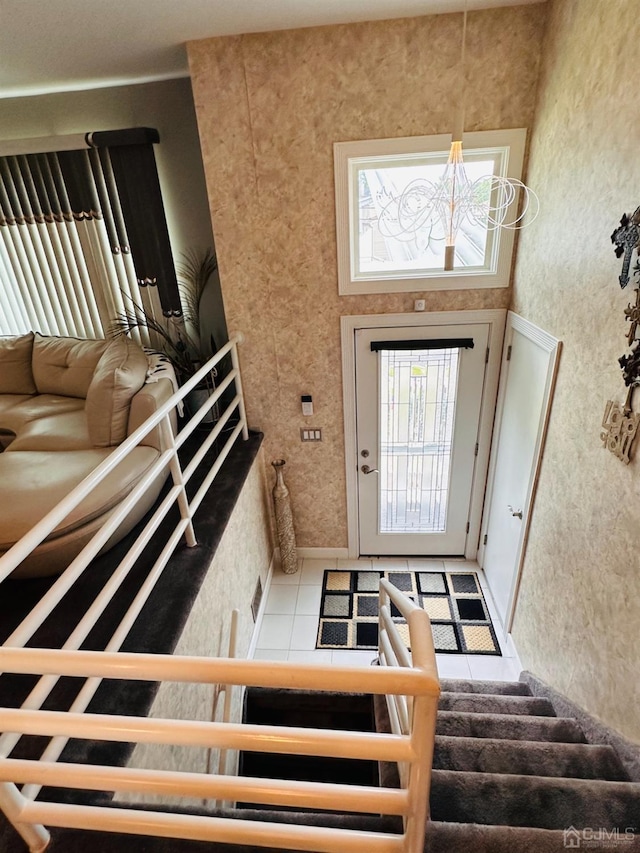 foyer with light tile patterned flooring