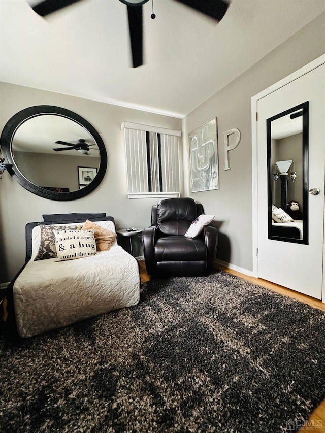 living room with hardwood / wood-style floors and ceiling fan