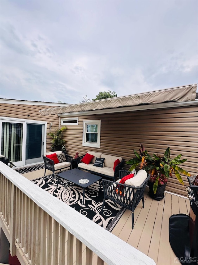 deck featuring an outdoor living space