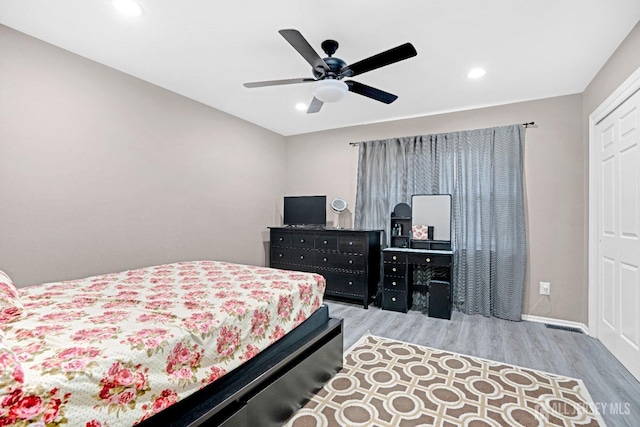 bedroom with ceiling fan, recessed lighting, baseboards, and wood finished floors