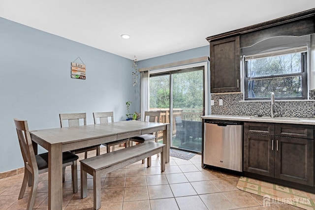 dining area featuring light tile patterned flooring and recessed lighting