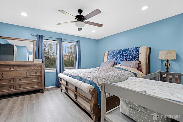 bedroom featuring a ceiling fan, light wood-style flooring, baseboards, and recessed lighting