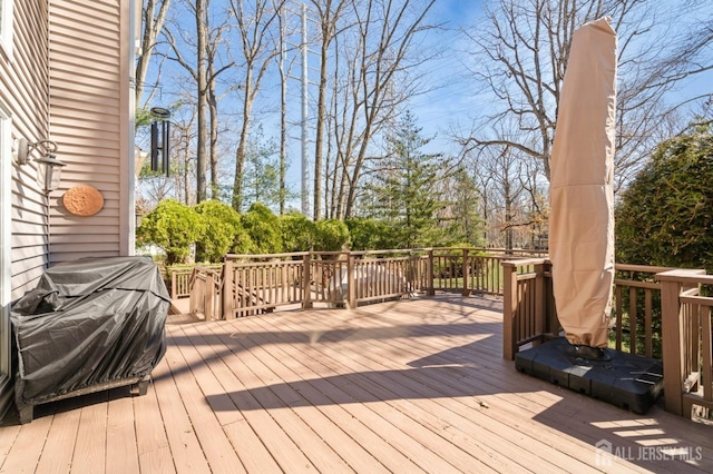 wooden deck featuring grilling area