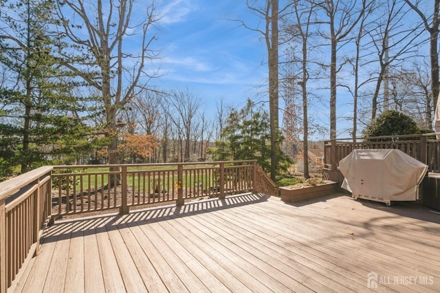 wooden deck with grilling area