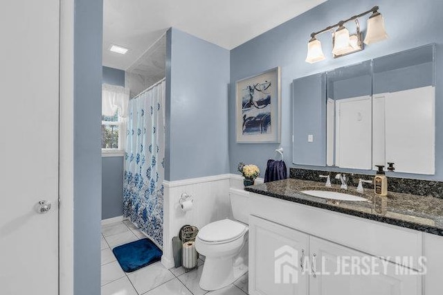 3 Topaz Ln, Iselin, NJ 08830 - full bath featuring vanity, wainscoting, tile patterned flooring, and a shower with curtain