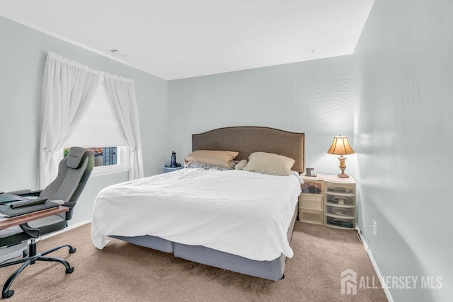 3 Topaz Ln, Iselin, NJ 08830 - carpeted bedroom with a desk and baseboards