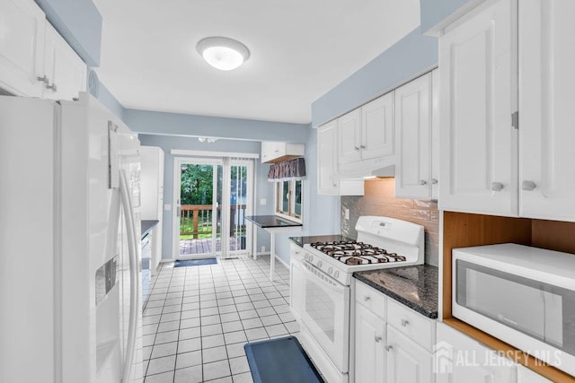 3 Topaz Ln, Iselin, NJ 08830 - kitchen with white appliances, light tile patterned floors, white cabinets, decorative backsplash, and under cabinet range hood