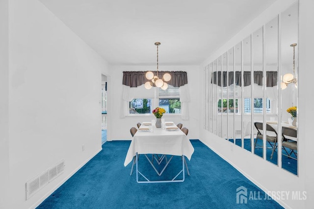 3 Topaz Ln, Iselin, NJ 08830 - carpeted dining space with a chandelier and baseboards