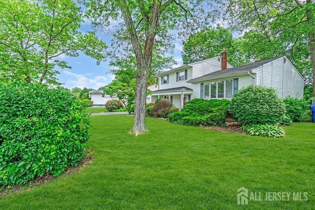 3 Topaz Ln, Iselin, NJ 08830 - view of front of property with a chimney and a front yard