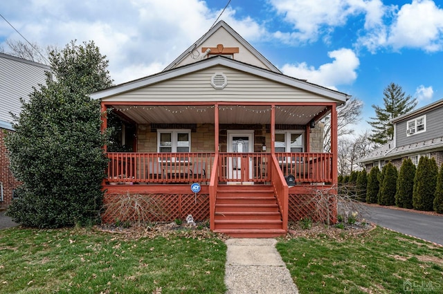 1156 Kline Pl, Rahway, NJ 07065 - bungalow-style home featuring covered porch, stone siding, and a front yard