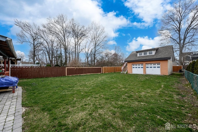 1156 Kline Pl, Rahway, NJ 07065 - fenced backyard featuring a garage and stairs