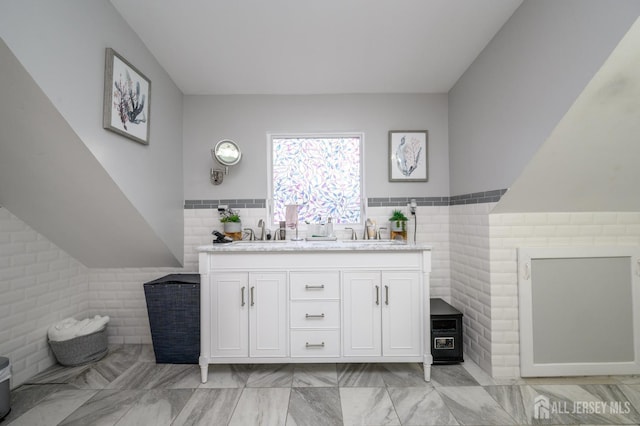 1156 Kline Pl, Rahway, NJ 07065 - bathroom featuring tile walls, double vanity, wainscoting, and marble finish floors