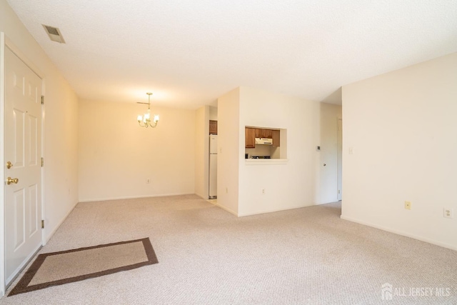 5108 Ravens Crest Dr, Plainsboro, NJ 08536 - spare room with a chandelier and light colored carpet