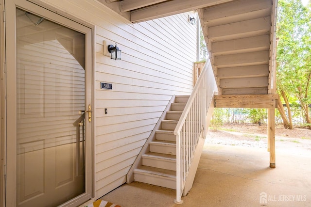 doorway to property with a patio area