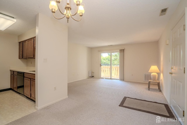 interior space with a chandelier, light colored carpet, baseboards, and a textured ceiling