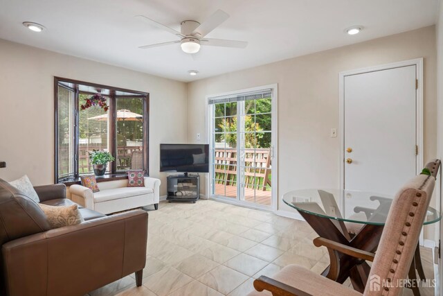44 Frost Ave, East Brunswick, NJ 08816 - living area with a ceiling fan and baseboards