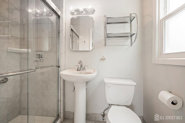 44 Frost Ave, East Brunswick, NJ 08816 - full bathroom featuring toilet, a shower stall, and baseboards