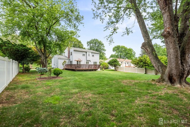 44 Frost Ave, East Brunswick, NJ 08816 - view of yard with a wooden deck