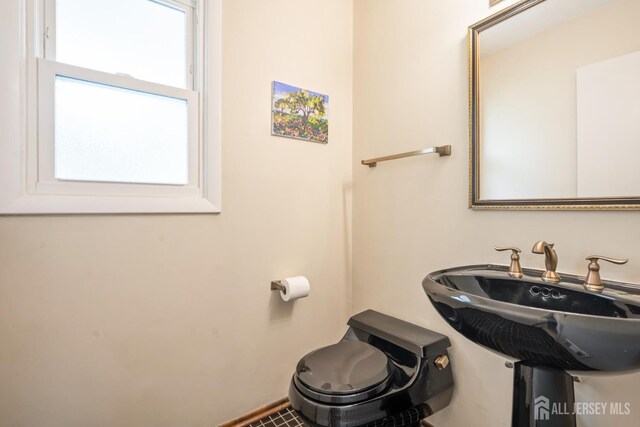44 Frost Ave, East Brunswick, NJ 08816 - half bathroom featuring toilet and baseboards