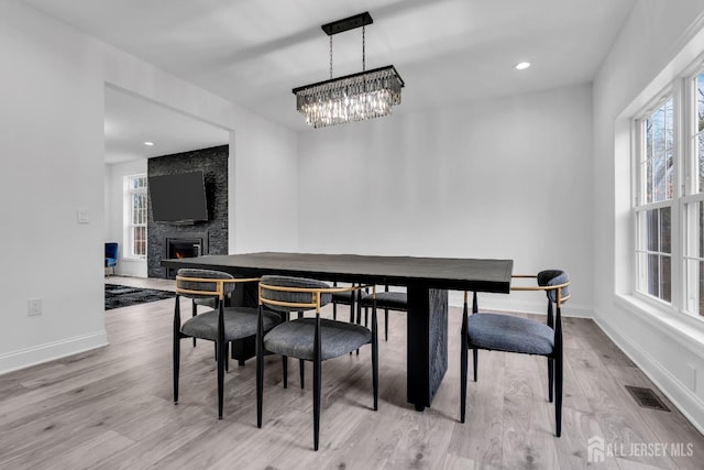 131-B Dutch Rd, East Brunswick, NJ 08816 - dining room with a fireplace, light wood-style floors, baseboards, a chandelier, and recessed lighting