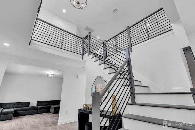 131-B Dutch Rd, East Brunswick, NJ 08816 - stairway with wood finished floors, recessed lighting, baseboards, and a high ceiling