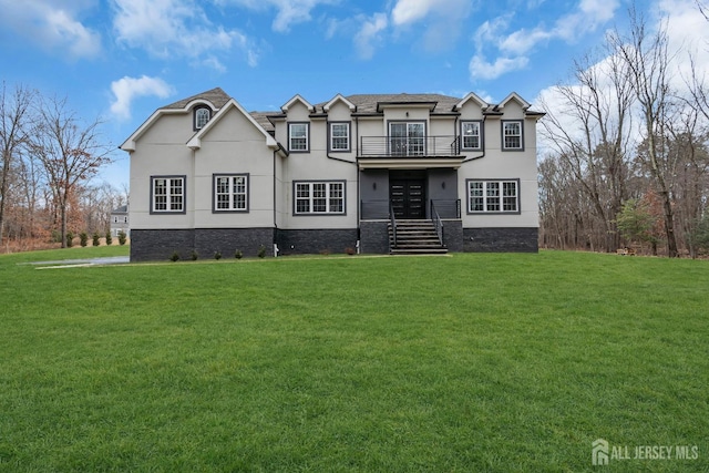 131-B Dutch Rd, East Brunswick, NJ 08816 - view of front of home with a balcony, a front yard, stucco siding, and stairs