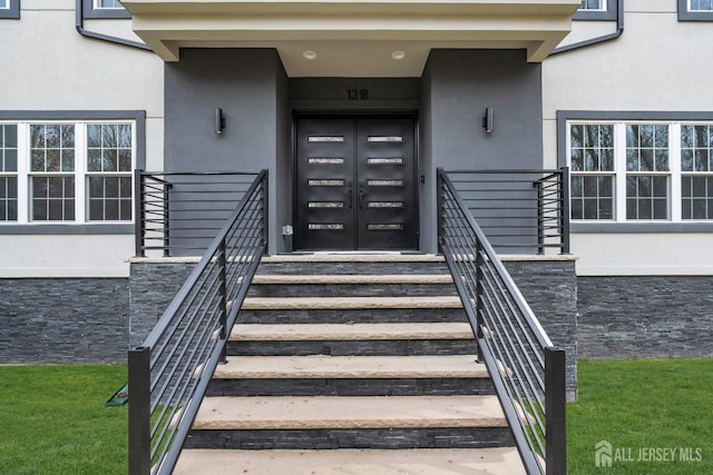 131-B Dutch Rd, East Brunswick, NJ 08816 - doorway to property with stucco siding and stone siding