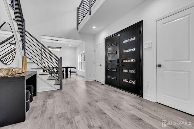 131-B Dutch Rd, East Brunswick, NJ 08816 - entryway featuring stairs, wood finished floors, a chandelier, baseboards, and recessed lighting