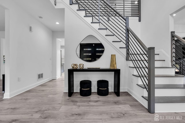 131-B Dutch Rd, East Brunswick, NJ 08816 - stairs featuring baseboards, wood finished floors, and recessed lighting