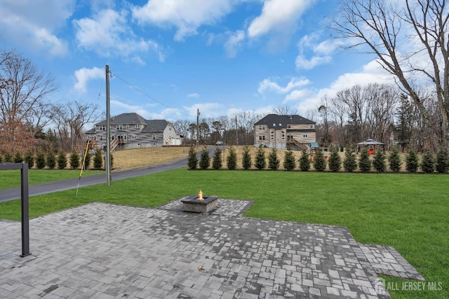 131-B Dutch Rd, East Brunswick, NJ 08816 - surrounding community with a fire pit, a lawn, and a patio area