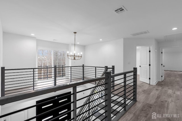 131-B Dutch Rd, East Brunswick, NJ 08816 - hallway featuring a chandelier, an upstairs landing, recessed lighting, wood finished floors, and attic access