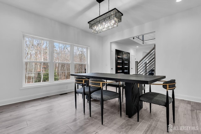 131-B Dutch Rd, East Brunswick, NJ 08816 - dining area featuring baseboards, stairs, a chandelier, light wood-type flooring, and recessed lighting
