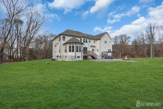 131-B Dutch Rd, East Brunswick, NJ 08816 - back of house with a yard and a deck