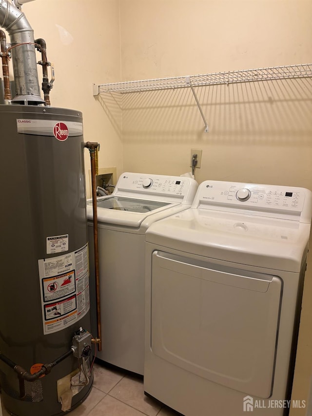 2102 Bayhead Dr Unit 2102, Sayreville, NJ 08859 - laundry room featuring gas water heater, washing machine and dryer, and light tile patterned flooring