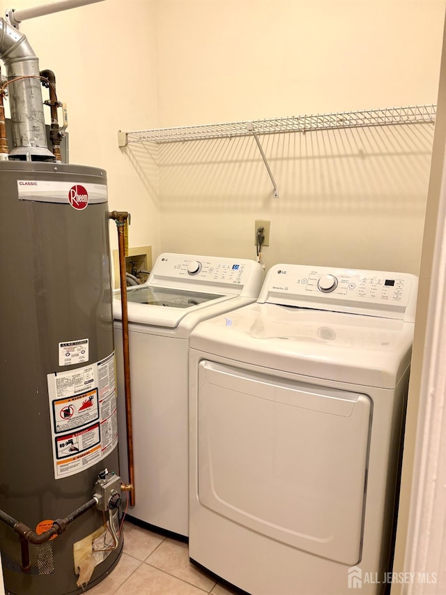 2102 Bayhead Dr Unit 2102, Sayreville, NJ 08859 - laundry room featuring water heater, separate washer and dryer, and light tile patterned flooring