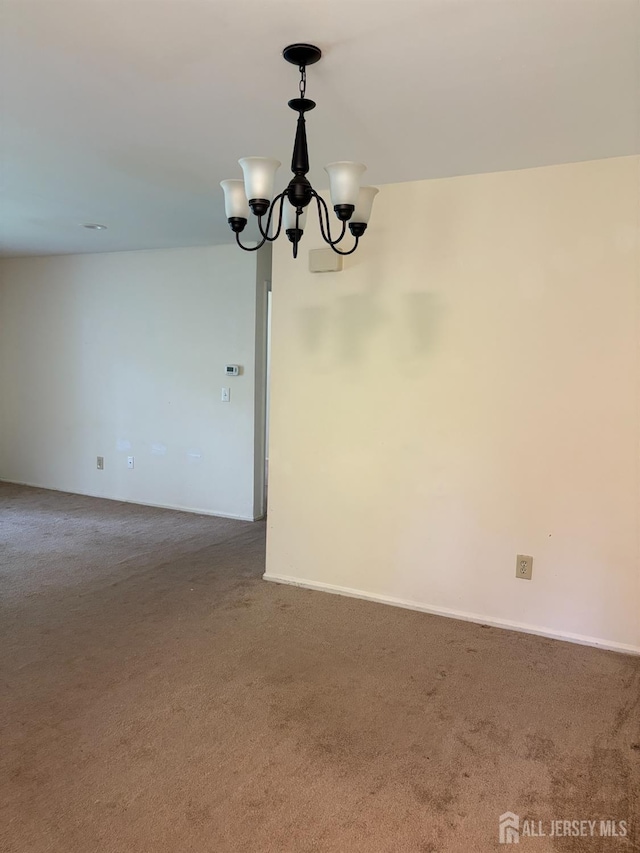 2102 Bayhead Dr Unit 2102, Sayreville, NJ 08859 - spare room with carpet and a chandelier