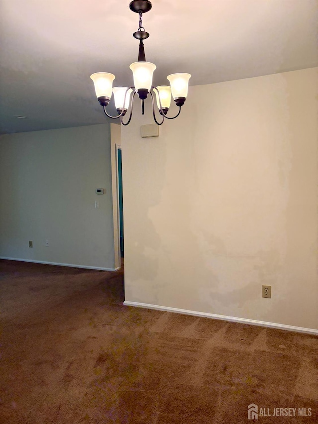 2102 Bayhead Dr Unit 2102, Sayreville, NJ 08859 - carpeted empty room with a chandelier and baseboards