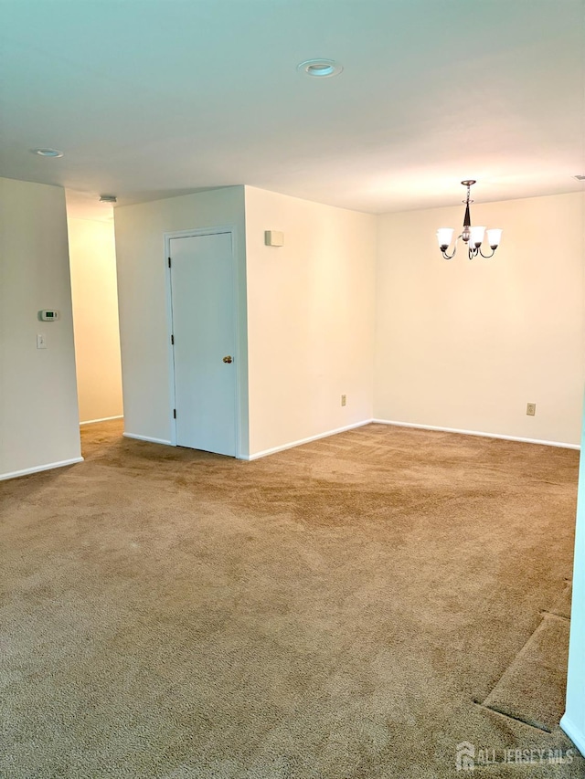 2102 Bayhead Dr Unit 2102, Sayreville, NJ 08859 - carpeted spare room featuring a chandelier and baseboards