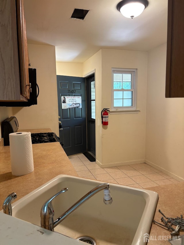 2102 Bayhead Dr Unit 2102, Sayreville, NJ 08859 - kitchen with light countertops, light tile patterned flooring, and range with gas cooktop