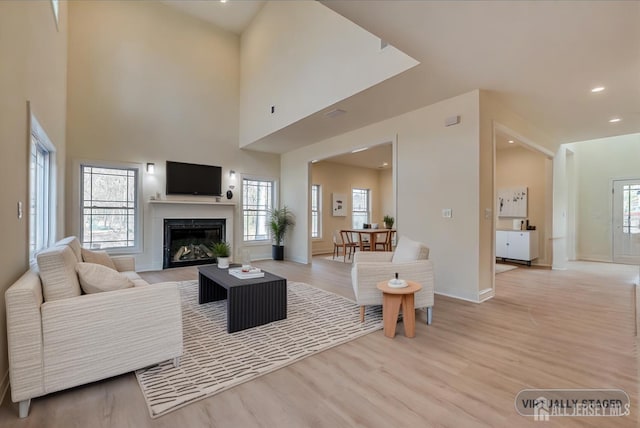 90 Hancock Rd, Piscataway, NJ 08854 - living room with light wood-style floors, a glass covered fireplace, and recessed lighting