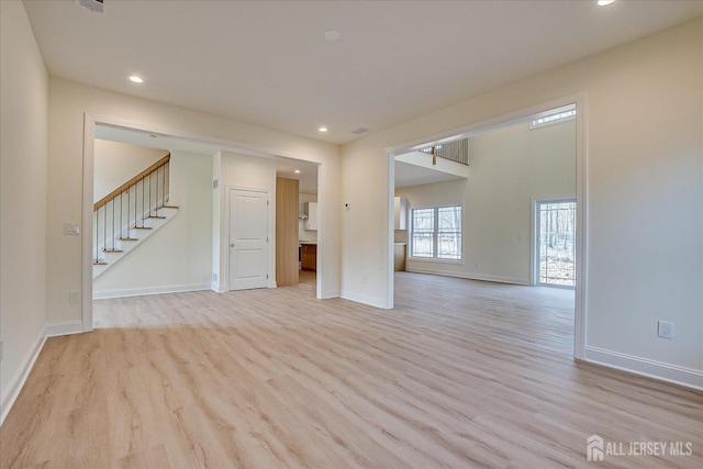 90 Hancock Rd, Piscataway, NJ 08854 - spare room with light wood-type flooring, stairway, and recessed lighting
