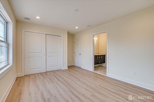 90 Hancock Rd, Piscataway, NJ 08854 - unfurnished bedroom featuring light wood-style flooring, a closet, recessed lighting, and ensuite bathroom