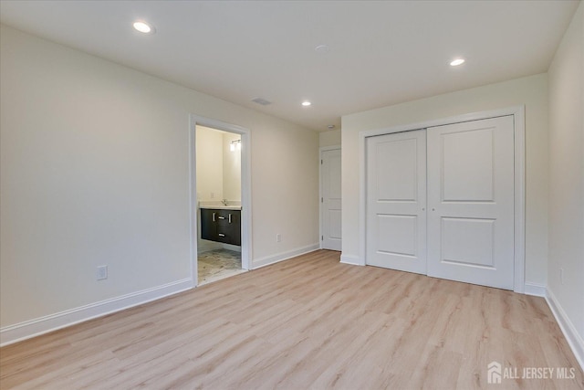 90 Hancock Rd, Piscataway, NJ 08854 - unfurnished bedroom with light wood-style floors, recessed lighting, a closet, and ensuite bathroom