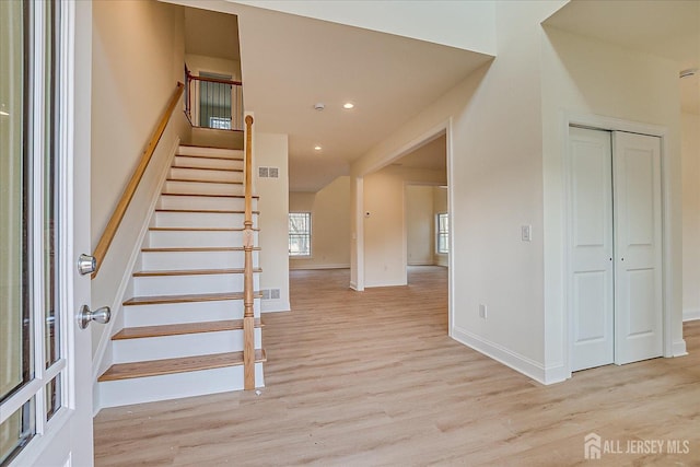 90 Hancock Rd, Piscataway, NJ 08854 - stairway with wood finished floors and recessed lighting