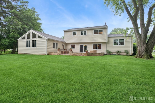 6 Steven Rd, South Brunswick, NJ 08824 - back of property with a lawn and a patio area
