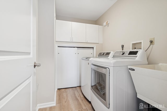 6 Steven Rd, South Brunswick, NJ 08824 - laundry room with separate washer and dryer, light wood-type flooring, and cabinet space