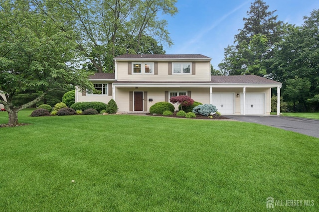 6 Steven Rd, South Brunswick, NJ 08824 - split level home featuring an attached garage, asphalt driveway, a front yard, and a shingled roof