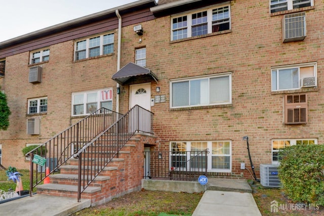 view of front of house featuring cooling unit