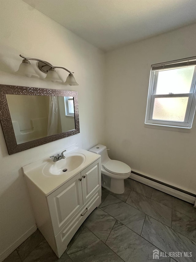 66 Fox Rd Unit 10A, Edison, NJ 08817 - full bath with a baseboard radiator, plenty of natural light, vanity, and a shower with shower curtain